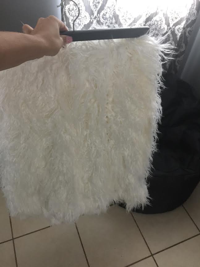 white throw on a hanger