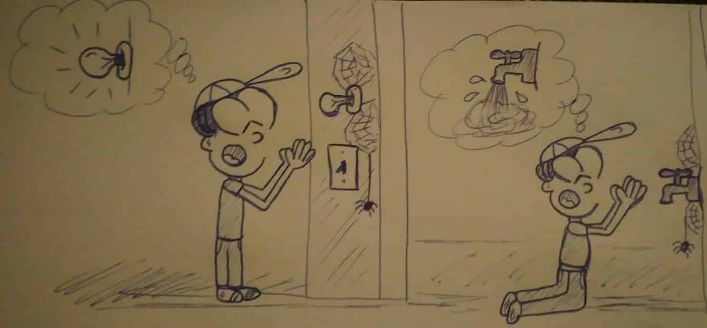Muñeco orando al frente de un interruptor de electricidad