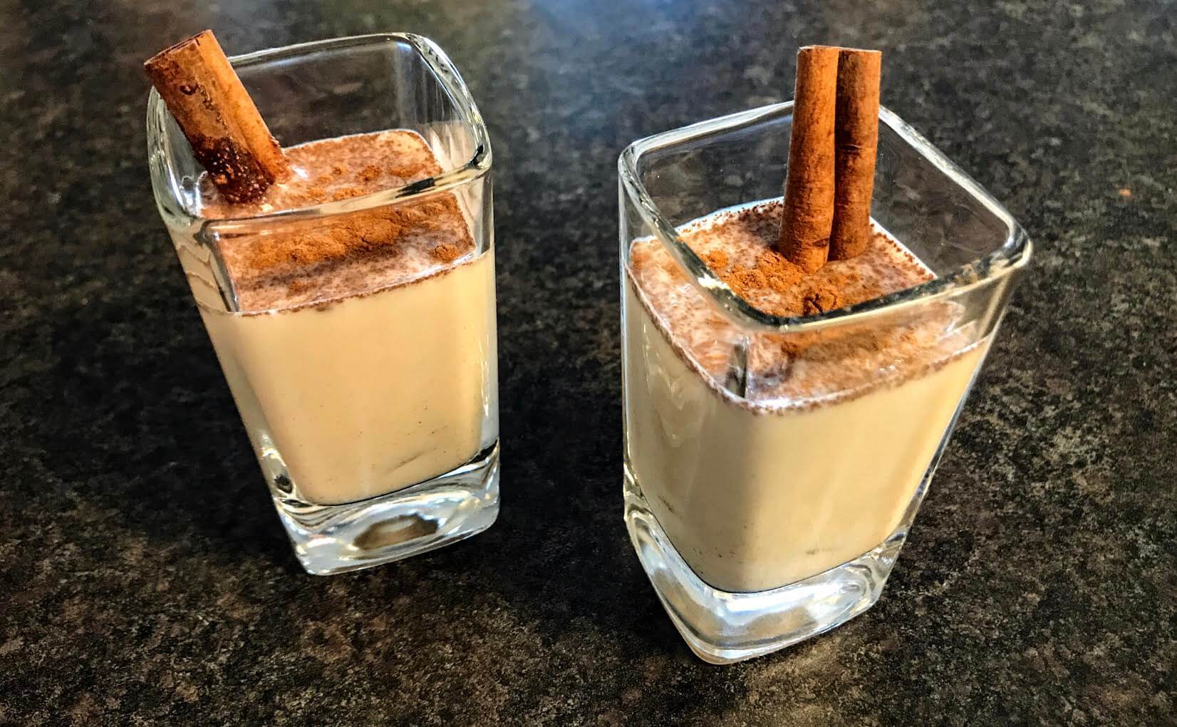 coquito served in glass shots with cinnamon