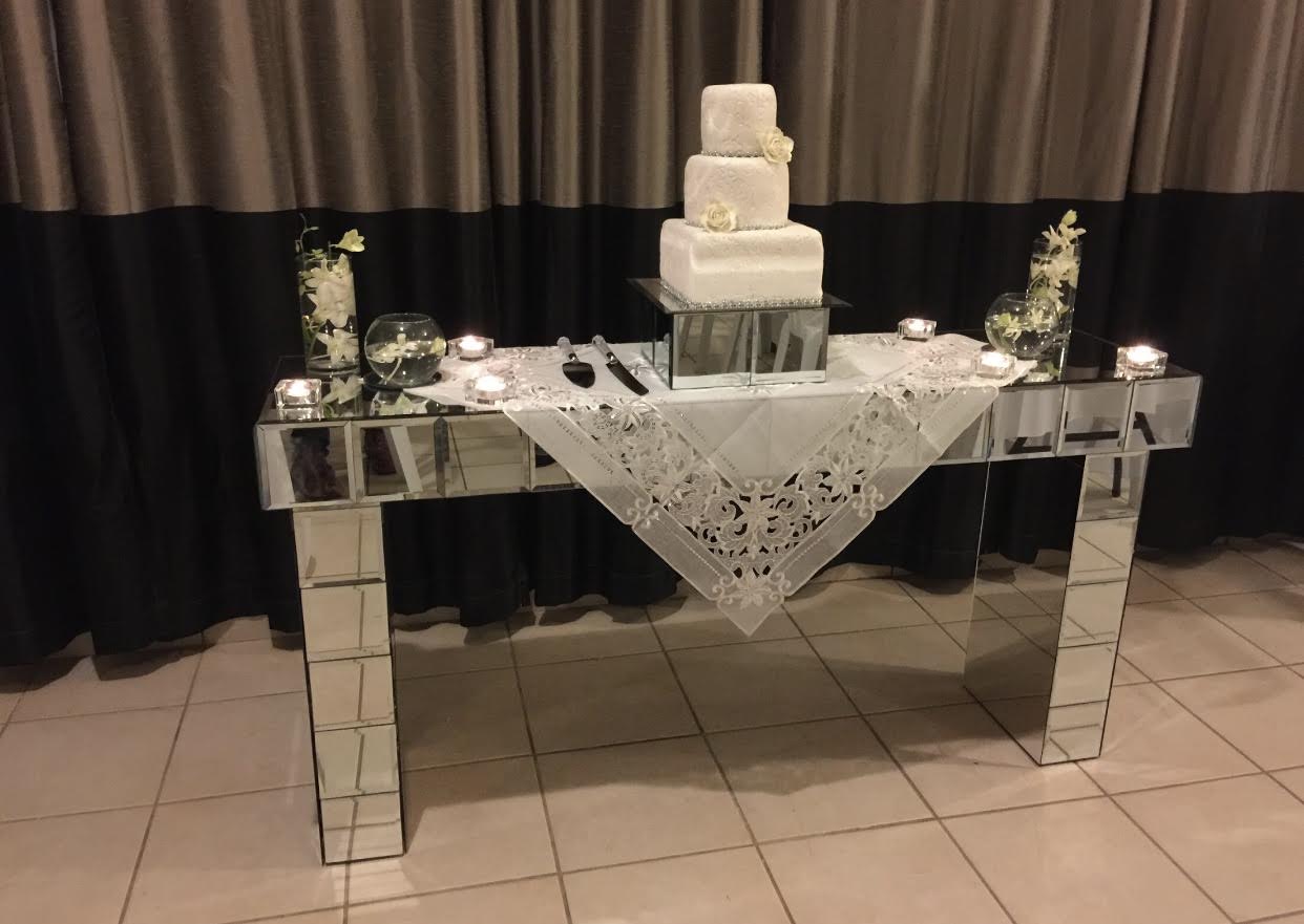 mirrored entryway with a cake on top of it