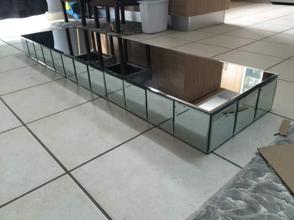 top for a diy mirrored entryway table fully covered in mirrors