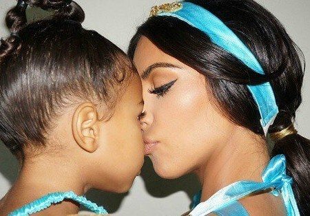 Kim Kardashian kissing her daughter North West on her nose